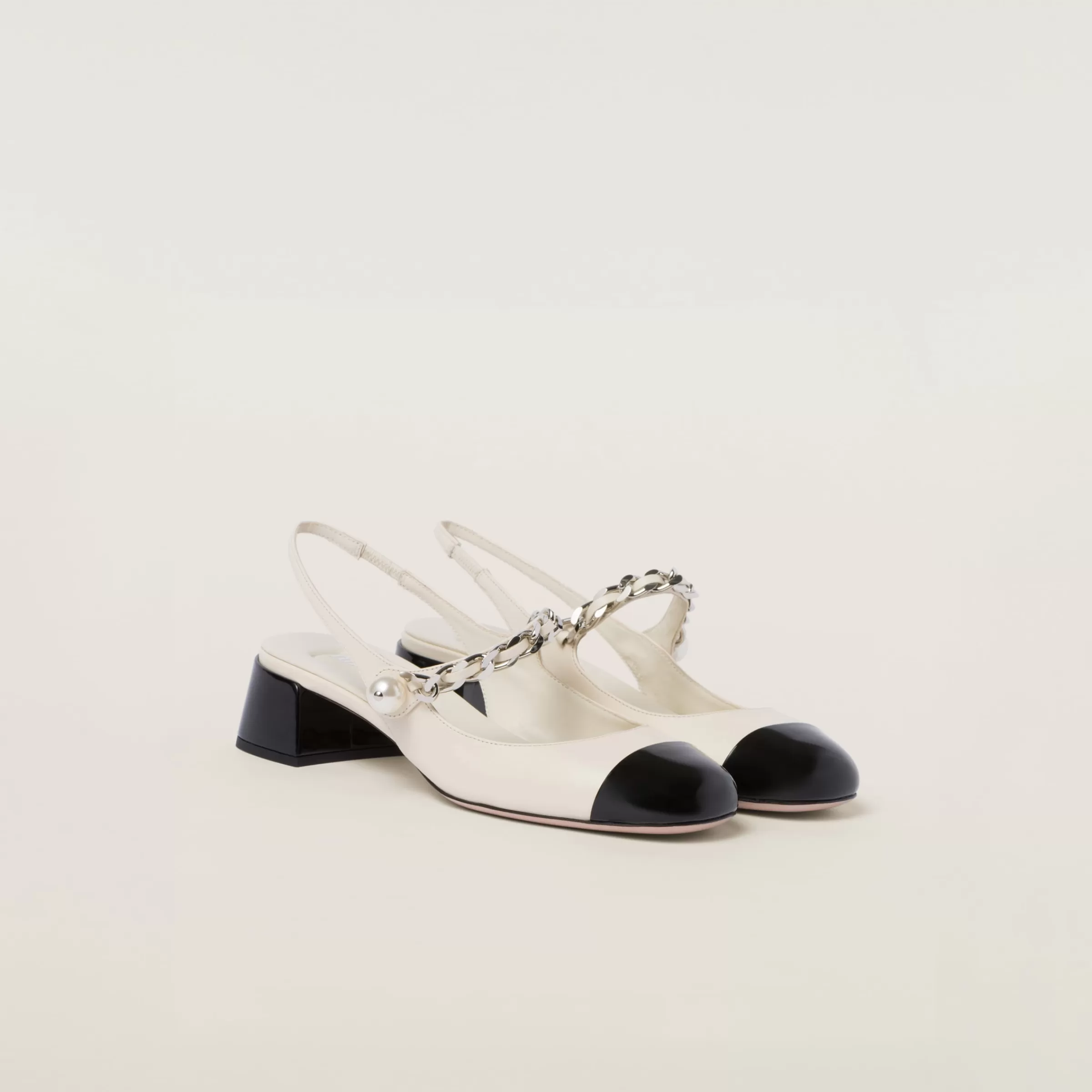 Miu Miu Leather And Patent Leather Slingback Pumps |
