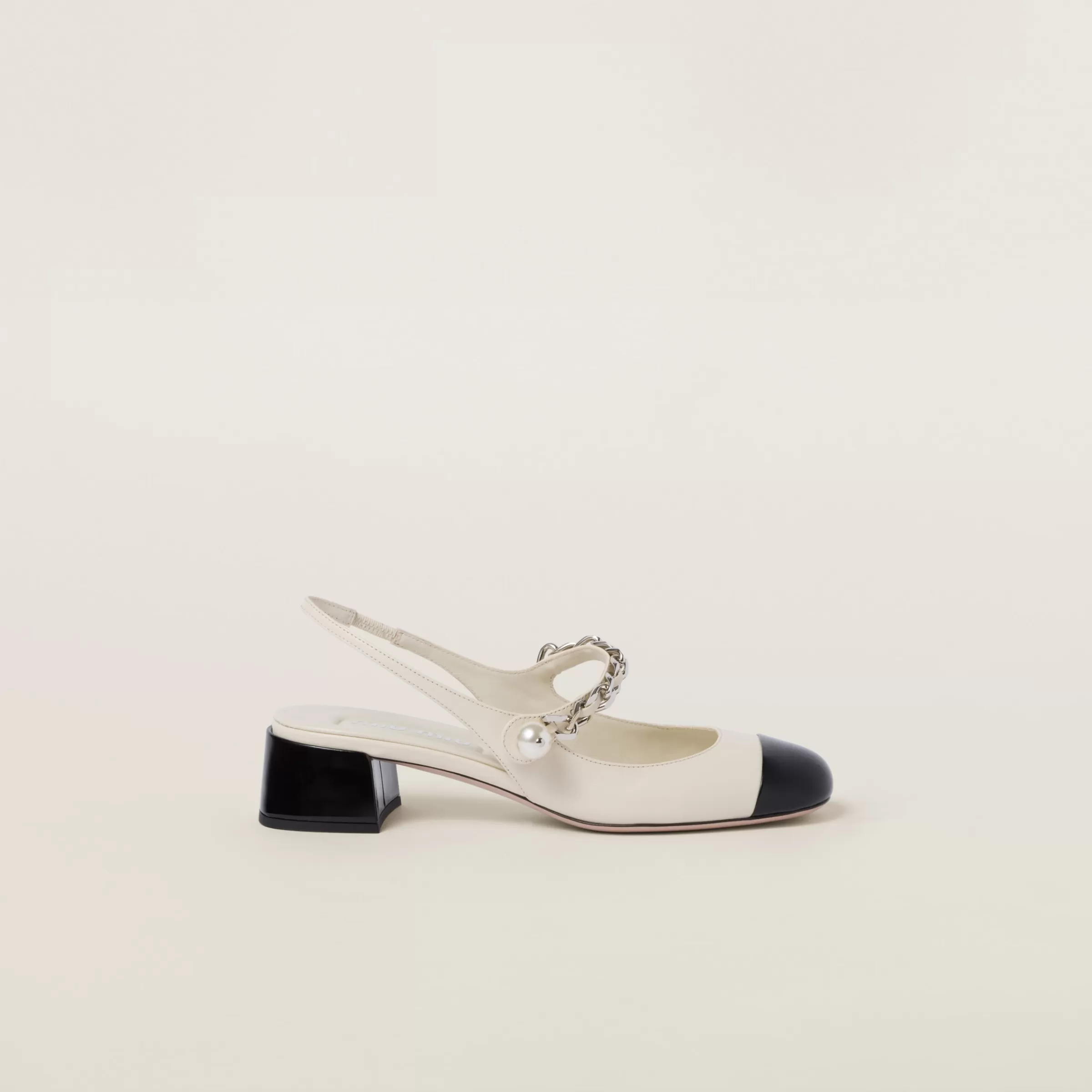 Miu Miu Leather And Patent Leather Slingback Pumps |