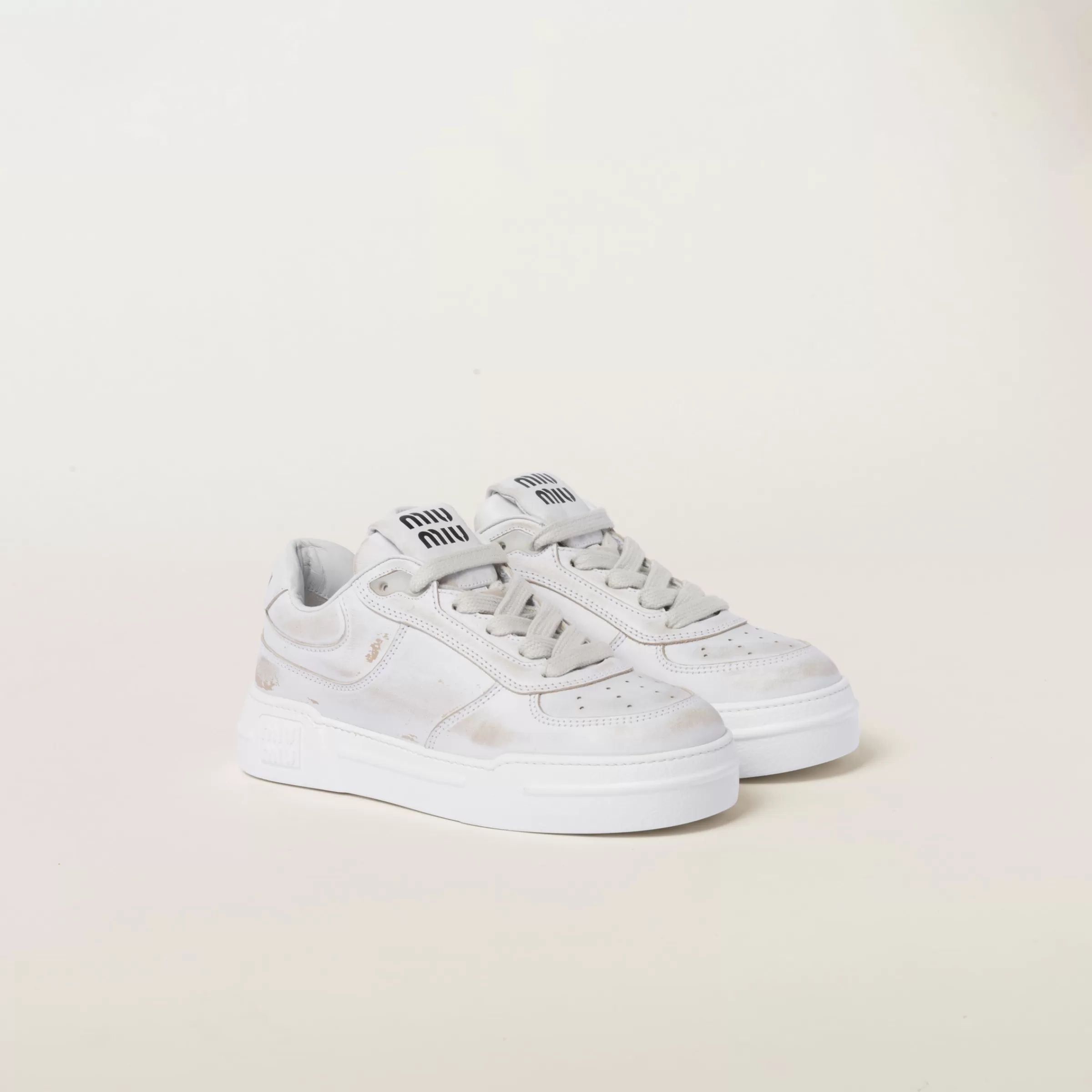 Miu Miu Bleached Leather Sneakers |