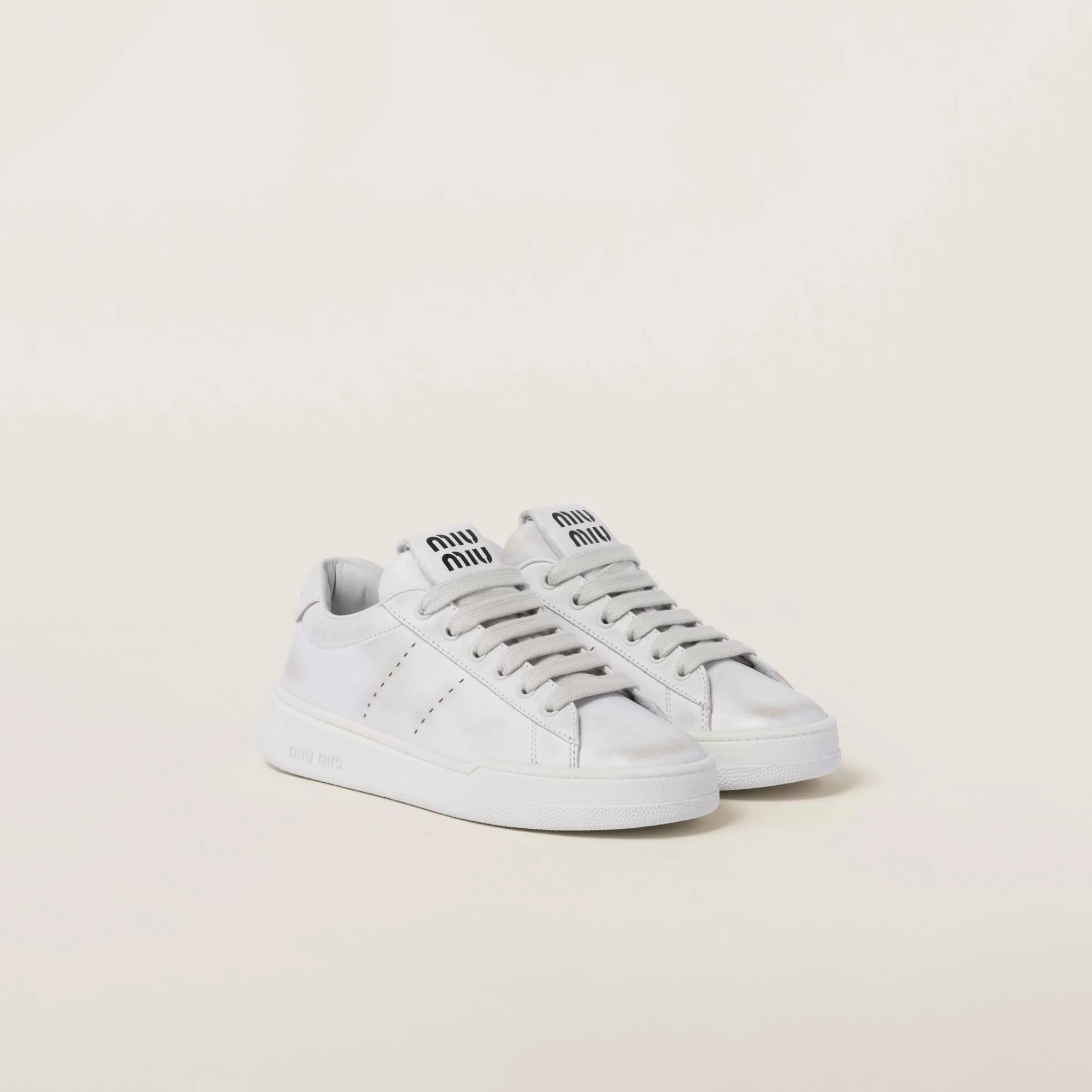 Miu Miu Bleached Leather Sneakers |