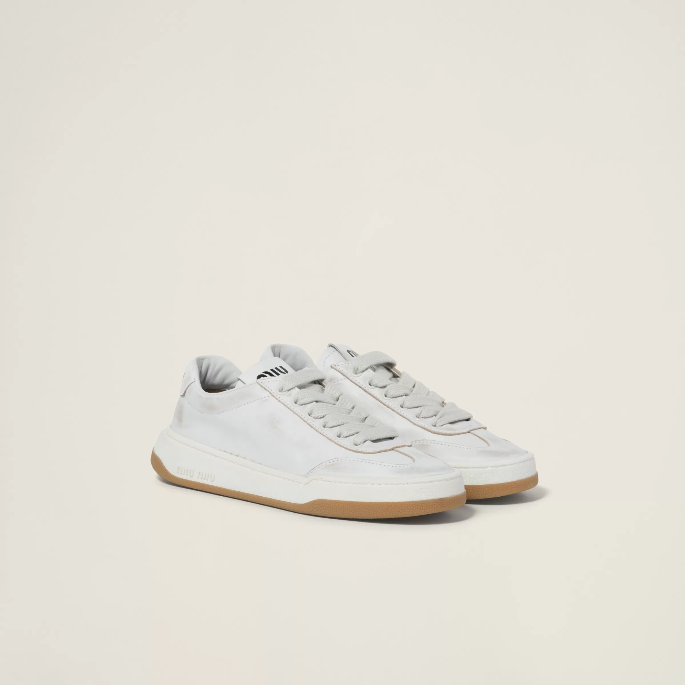 Miu Miu Bleached Leather Sneakers |